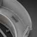 Gray hand-painted aluminum fire table with curved design and visible welds, showcasing its sturdy construction.