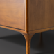 Madri dresser, a minimalist modern brown wood dresser with sleek, tapered legs.