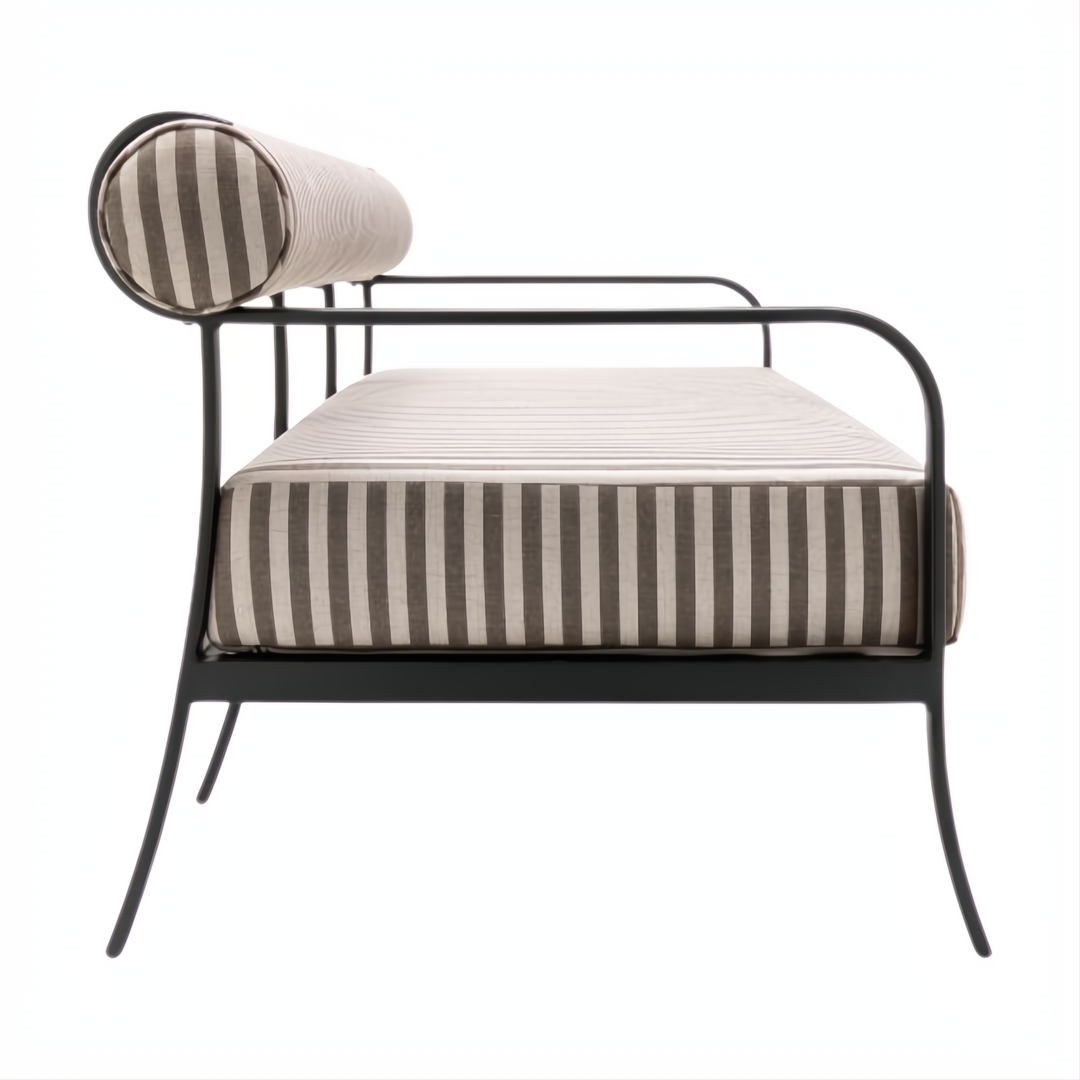 Surya Antibes outdoor sofa with brown and beige striped Sunbrella acrylic cushions on a black aluminum base.