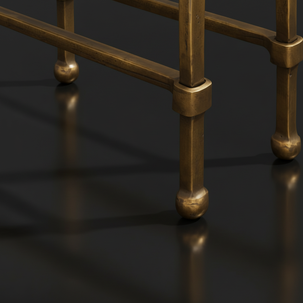 Close-up of the metallic brass iron base and legs of the Surya Engel coffee table.