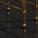 Close-up of the metallic brass iron base and legs of the Surya Engel coffee table.