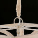 Close-up of Surya Braylee chandelier's rope-wrapped chain and distressed white metal/wood frame.