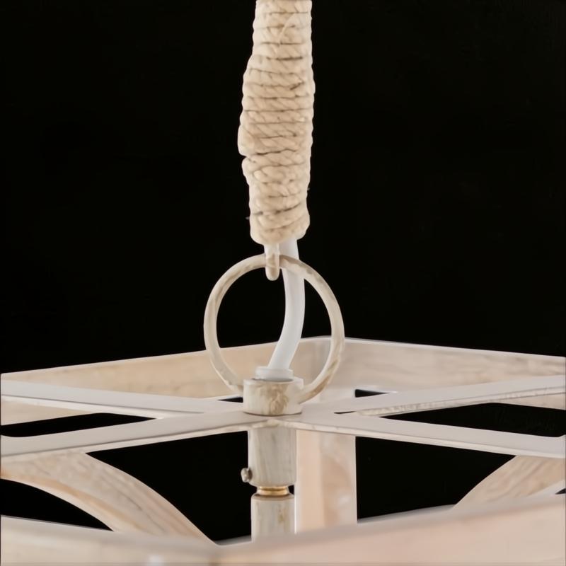 Close-up of Surya Braylee chandelier's rope-wrapped chain and distressed white metal/wood frame.
