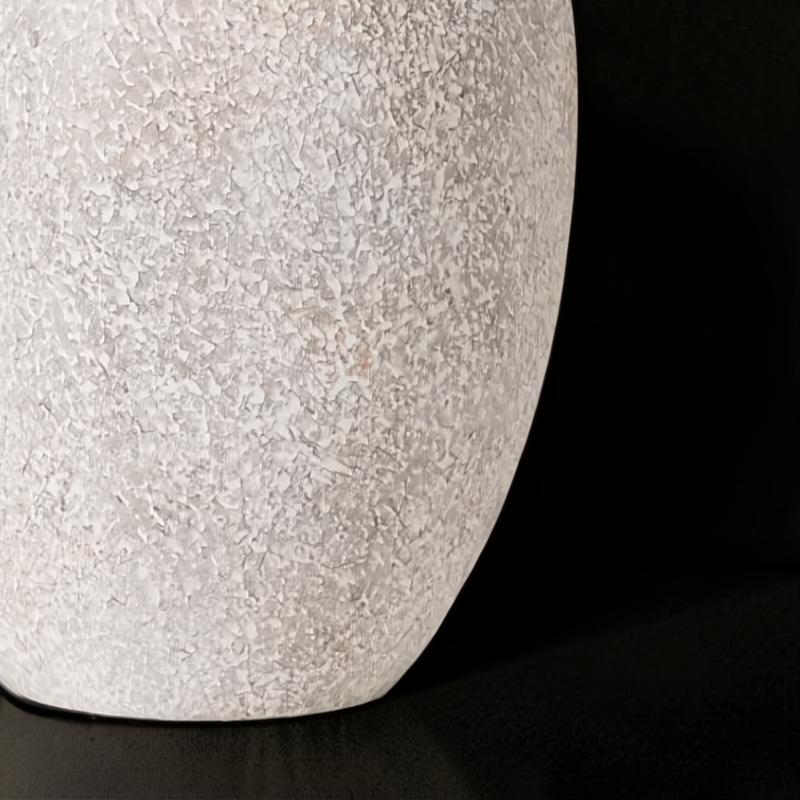 Close-up of Surya Capelli accent table lamp's textured ceramic base in a light, speckled finish.