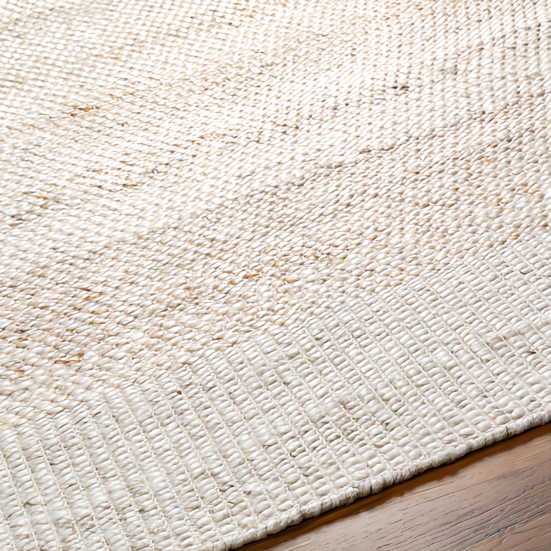 Close-up of a hand-woven Surya Abby ABB-2301 area rug in a natural, off-white recycled PET yarn.
