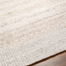 Close-up of a hand-woven Surya Abby ABB-2301 area rug in a natural, off-white recycled PET yarn.