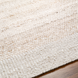 Close-up of a hand-woven Surya Abby ABB-2301 area rug in a natural, off-white recycled PET yarn.