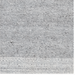 Hand-woven gray and white recycled PET yarn area rug with a subtle, textured pattern.