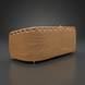 Back view of a light brown woven sofa with a curved top edge and small round feet.