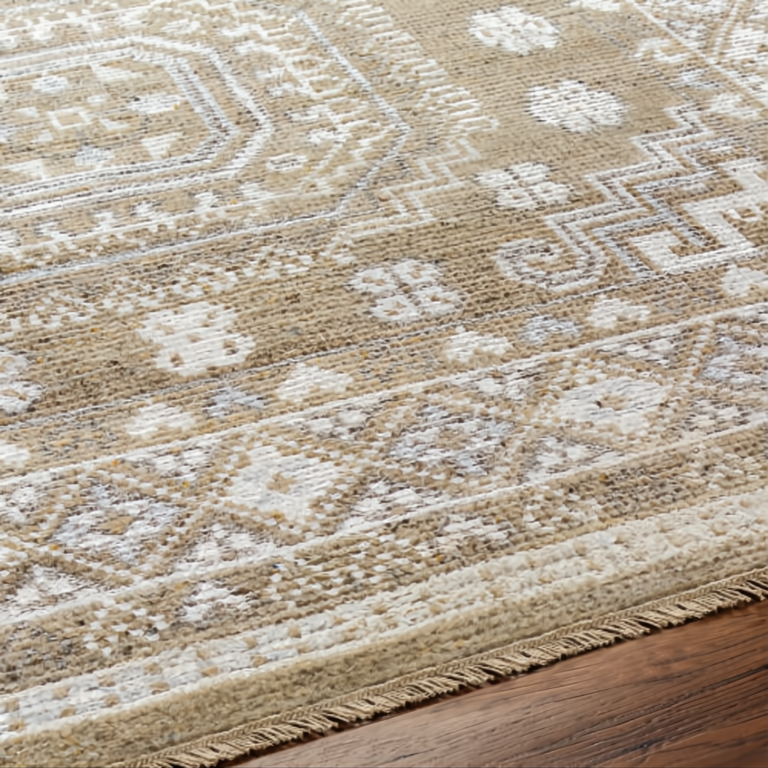 Surya Almeria hand-knotted low pile rug with mustard, gray, blue, beige, cream, and black geometric patterns.