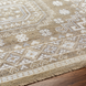 Surya Almeria hand-knotted low pile rug with mustard, gray, blue, beige, cream, and black geometric patterns.