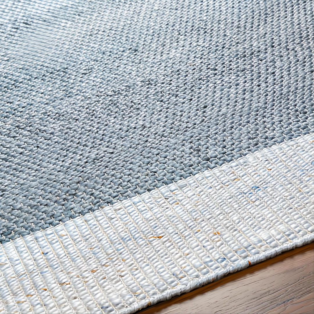 Close-up of a hand-woven Surya Abby ABB-2302 area rug with blue and white recycled PET yarn, flat no-pile texture.