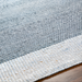 Close-up of a hand-woven Surya Abby ABB-2302 area rug with blue and white recycled PET yarn, flat no-pile texture.