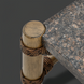 Surya Porta outdoor coffee table with charcoal matte stone top, brown hand-painted aluminum base, and PE rope detail.