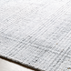 Surya Hope HOP-2303-P hand-loomed flatwoven area rug in white, gray, and light slate recycled PET yarn.
