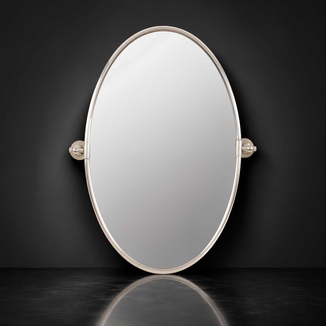 Surya Burnish oval wall mirror with antiqued metallic silver brass frame, vertically mounted.