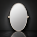 Surya Burnish oval wall mirror with antiqued metallic silver brass frame, vertically mounted.