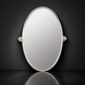 Surya Burnish oval wall mirror with antiqued metallic silver brass frame, vertically mounted.