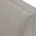 Close-up of light gray polyester and linen upholstered Surya Stinson Banquette Chair with subtle texture.