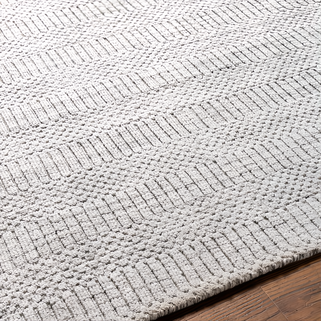 Surya Hickory HCK2302 hand-loomed rug in light beige, gray, and charcoal recycled PET yarn with textured stripes.