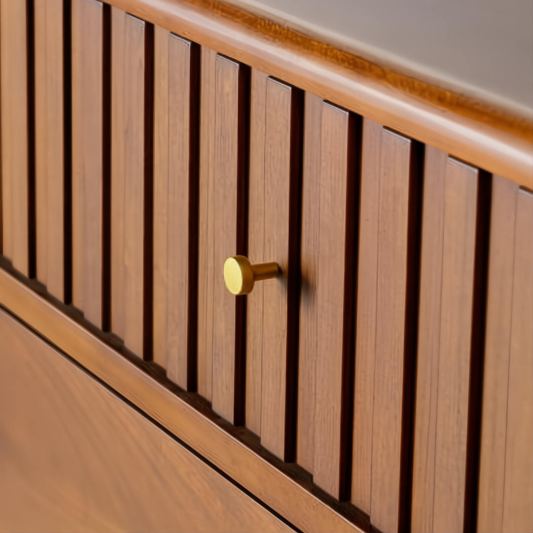 Madri dresser, a minimalist modern brown wood dresser with fluted drawer fronts and a gold knob.