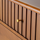 Madri dresser, a minimalist modern brown wood dresser with fluted drawer fronts and a gold knob.
