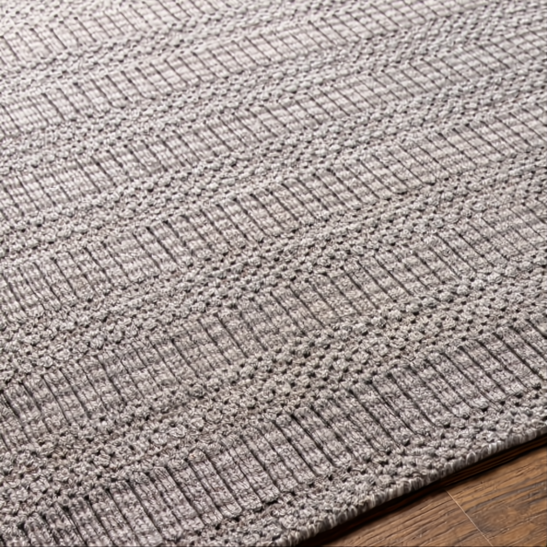 Surya Hickory HCK-2304 area rug, hand-loomed from recycled PET yarn, with a subtle textured pattern in gray and beige.