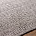 Surya Hickory HCK-2304 area rug, hand-loomed from recycled PET yarn, with a subtle textured pattern in gray and beige.