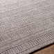 Surya Hickory HCK-2304 area rug, hand-loomed from recycled PET yarn, with a subtle textured pattern in gray and beige.