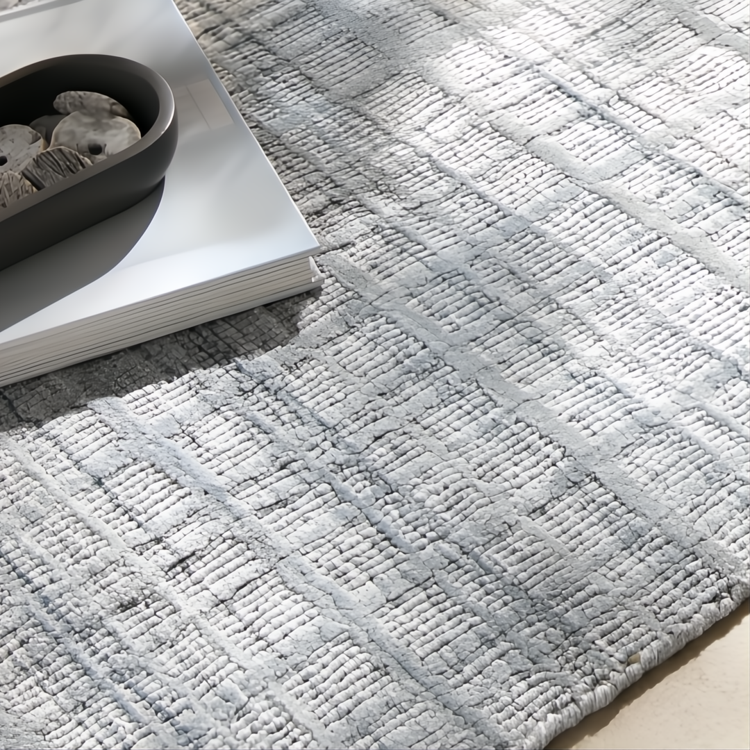 Surya Fresno FNO2304 light gray recycled PET yarn area rug with subtle geometric texture.