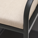 Close-up of a Surya Antibes dining chair with beige Sunbrella upholstery and a black aluminum frame.