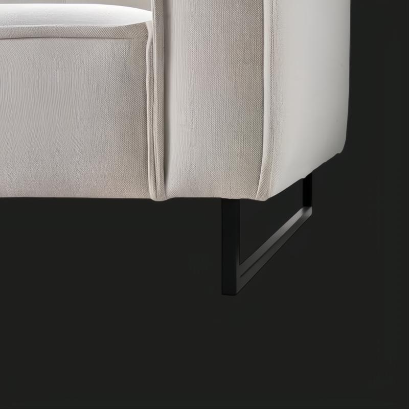 Light gray linen Surya Dylan sofa with a modern design and sturdy black painted iron base.