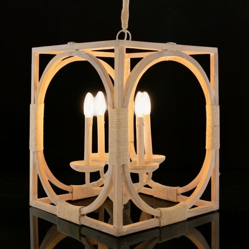 Surya Braylee 4-light chandelier with a light wood frame, rope accents, and candelabra bulbs.
