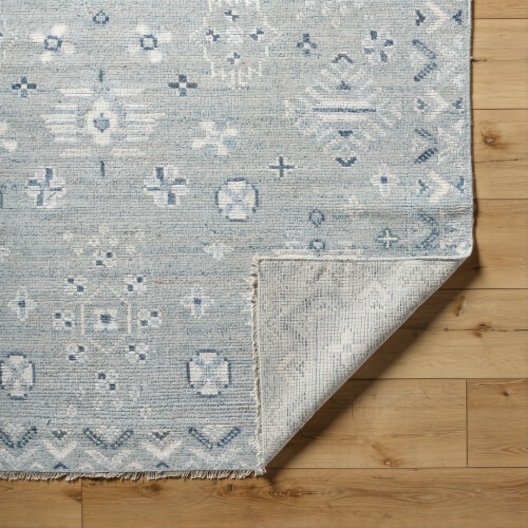 Hand-knotted Surya Almeria ALM2302 low pile rug in multi-tone Denim, Black, Dusty Sage, Light Beige, Cream, Burgundy.