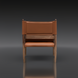 Modern Surya Chole accent chair with a brown leather top and mango wood base, viewed from the back.