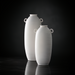 Surya Kushan cream ceramic decorative vase set with textured finish and loop handles.