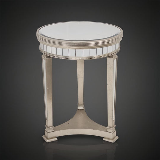 Antiqued mirrored pedestal side table with a round top, ribbed detailing, and three tapered legs.