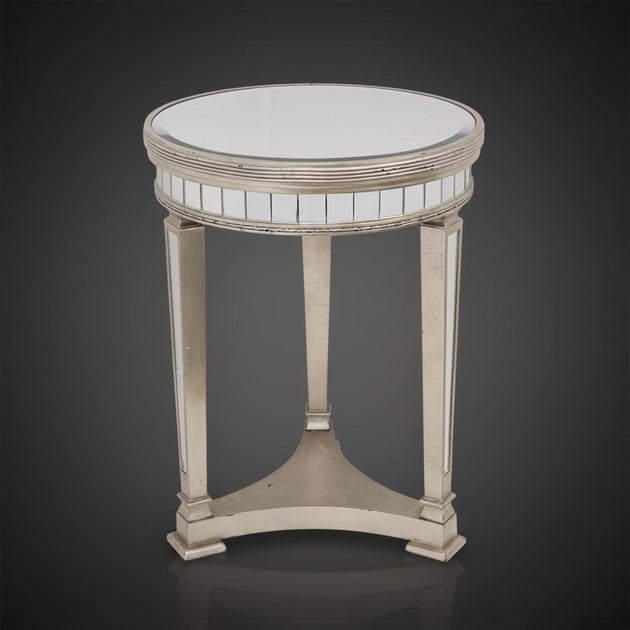 Antiqued mirrored pedestal side table with a round top, ribbed detailing, and three tapered legs.