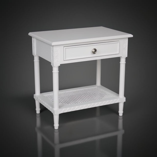 White Polo Side Table with single drawer, silver knob, and woven rattan lower shelf.