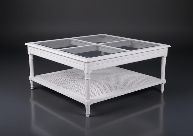 White Polo Square Coffee Table with glass top and cane shelf, featuring coastal elegance.