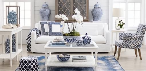 White Polo Square Coffee Table with glass top, open design, and lower shelf in a coastal living room.