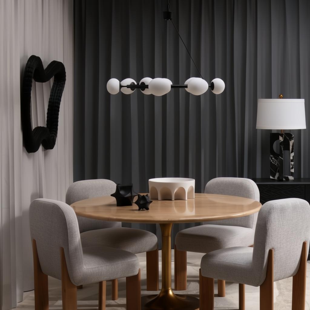 Four Surya Pico Dining Chairs with taupe polyester-linen upholstery and brown rubber wood bases around a round wooden table.