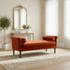 Surya Aneesa Bench with rust upholstery, brown rubber wood base, and bolster pillows in a living space.