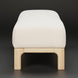 Light beige polyester Surya Bradly Bench with a simple design and beige stained red oak base.
