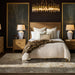 Brown natural Surya Hermosa nightstand with two drawers and metal pulls, flanking a bed in a stylish bedroom.