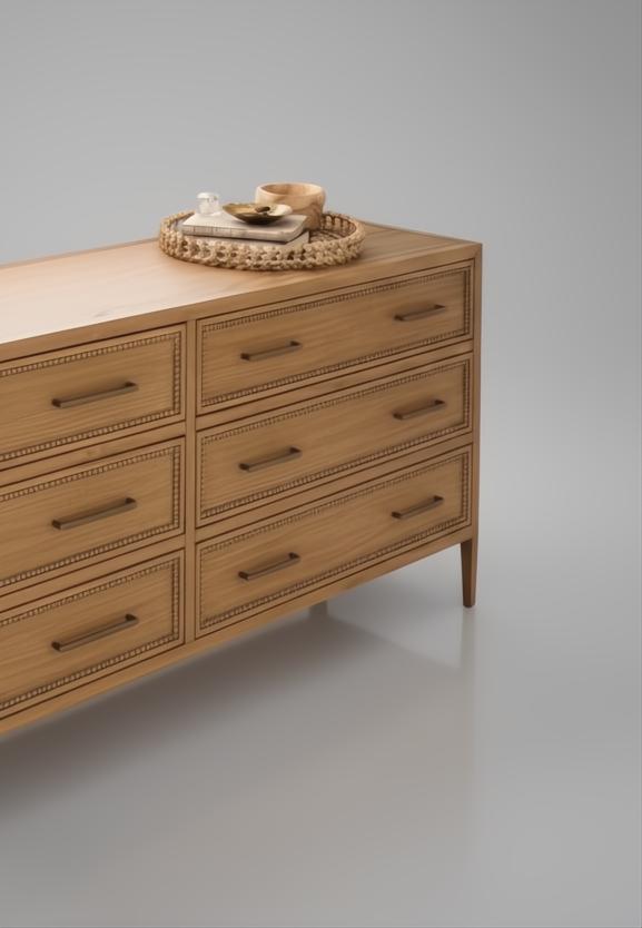 Wide brown painted oak veneer dresser with six soft-close drawers, brass pulls, and a woven tray on top.