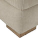 Close-up of a Surya Lloyd Power Sectional corner with light beige polyester upholstery and a brown stained plywood base.