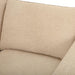Close-up of a textured beige polyester sofa cushion, showing its plush, inviting surface.