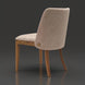 Surya Brooke dining chair with medium brown polyester upholstery, wheat-finished beechwood base, and decorative button.
