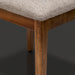 Surya Brooke dining chair with medium brown polyester upholstery and wheat-finished beechwood legs.